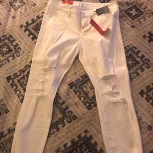 White ripped capris.